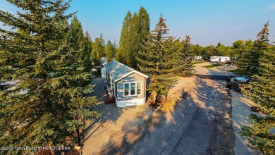 Discover a charming park model in the heart of Star Valley Ranch on Star Valley RV Golf Course in Wyoming - for sale on GolfHomes.com, golf home, golf lot