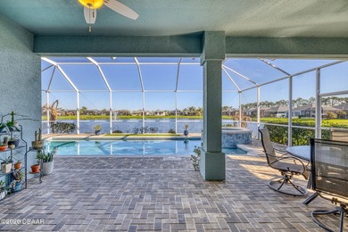 Step into a world of thoughtful beauty in this custom waterfront on Venetian Bay Golf Course in Florida - for sale on GolfHomes.com, golf home, golf lot