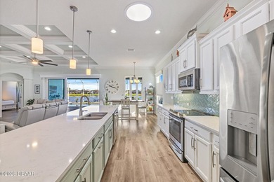 Step into a world of thoughtful beauty in this custom waterfront on Venetian Bay Golf Course in Florida - for sale on GolfHomes.com, golf home, golf lot
