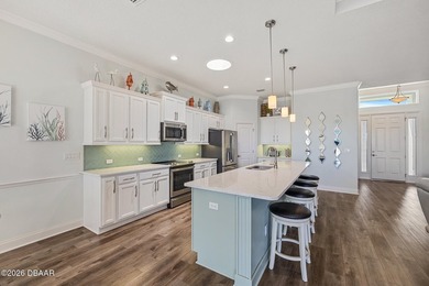 Step into a world of thoughtful beauty in this custom waterfront on Venetian Bay Golf Course in Florida - for sale on GolfHomes.com, golf home, golf lot