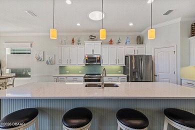 Step into a world of thoughtful beauty in this custom waterfront on Venetian Bay Golf Course in Florida - for sale on GolfHomes.com, golf home, golf lot