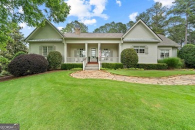 Tucked in the prestigious golf and lake community of Cuscowilla on The Golf Club at Cuscowilla in Georgia - for sale on GolfHomes.com, golf home, golf lot
