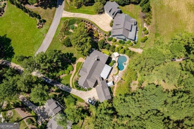 Tucked in the prestigious golf and lake community of Cuscowilla on The Golf Club at Cuscowilla in Georgia - for sale on GolfHomes.com, golf home, golf lot