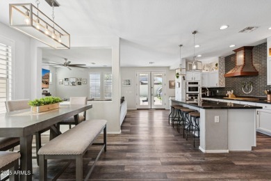 Stunning corner-lot home in Verrado welcomes you with an open on Verrado Golf Club  in Arizona - for sale on GolfHomes.com, golf home, golf lot