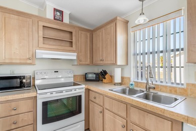 This beautifully maintained 2006 3-bedroom, 2-bath, 1 car on Kings Gate Golf Club in Florida - for sale on GolfHomes.com, golf home, golf lot