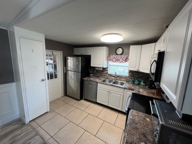 Welcome to this beautifully updated home located in the gated on Lake Fairways Country Club in Florida - for sale on GolfHomes.com, golf home, golf lot