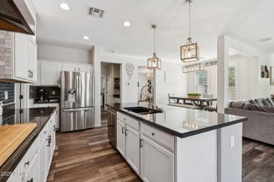 Stunning corner-lot home in Verrado welcomes you with an open on Verrado Golf Club  in Arizona - for sale on GolfHomes.com, golf home, golf lot