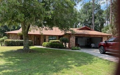 124343- Gorgeous 3/2 bath brick home in the Country Club. With a on Country Club At Lake City in Florida - for sale on GolfHomes.com, golf home, golf lot