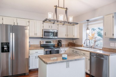 Stunning 2-story home features vaulted ceilings and a spacious on Hankerd Hills Golf Course in Michigan - for sale on GolfHomes.com, golf home, golf lot