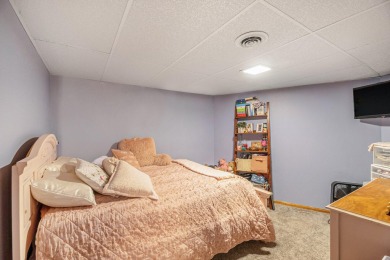 Stunning 2-story home features vaulted ceilings and a spacious on Hankerd Hills Golf Course in Michigan - for sale on GolfHomes.com, golf home, golf lot