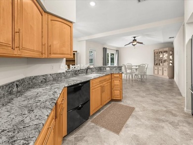 PRIDE OF OWNERSHIP shines throughout this beautifully maintained on Kingsway Country Club in Florida - for sale on GolfHomes.com, golf home, golf lot