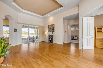 Experience lakeside living in this magnificent lakefront home in on Venetian Bay Golf Course in Florida - for sale on GolfHomes.com, golf home, golf lot