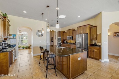 Experience lakeside living in this magnificent lakefront home in on Venetian Bay Golf Course in Florida - for sale on GolfHomes.com, golf home, golf lot