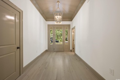 Perfectly situated in the private, gated community of DeBordieu on DeBordieu Country Club in South Carolina - for sale on GolfHomes.com, golf home, golf lot