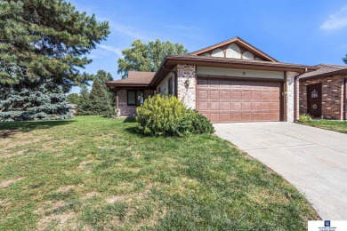 Welcome to desirable Wellington Greens! This end-unit ranch on Wellington Greens Golf Course in Nebraska - for sale on GolfHomes.com, golf home, golf lot