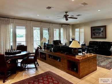This stunning custom-built home is situated on an oversize treed on Rancho Viejo Resort and Country Club in Texas - for sale on GolfHomes.com, golf home, golf lot