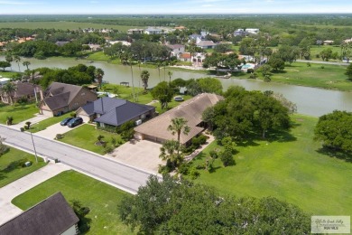 This stunning custom-built home is situated on an oversize treed on Rancho Viejo Resort and Country Club in Texas - for sale on GolfHomes.com, golf home, golf lot