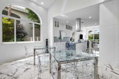 Soaring two-story ceiling heights greet you upon entering this on Polo Club of Boca Raton in Florida - for sale on GolfHomes.com, golf home, golf lot