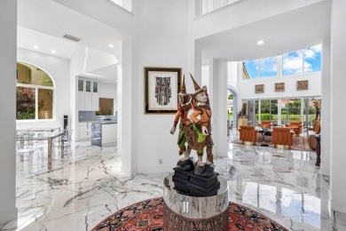 Soaring two-story ceiling heights greet you upon entering this on Polo Club of Boca Raton in Florida - for sale on GolfHomes.com, golf home, golf lot