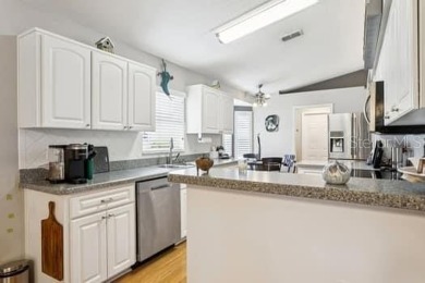 This immaculate home shows wonderfully and sits on one of the on River Ridge Golf Club in Florida - for sale on GolfHomes.com, golf home, golf lot