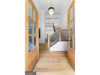 Welcome to this breathtaking four-sided brick estate, perfectly on Whitewater Creek in Georgia - for sale on GolfHomes.com, golf home, golf lot