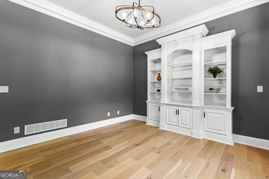 Welcome to this breathtaking four-sided brick estate, perfectly on Whitewater Creek in Georgia - for sale on GolfHomes.com, golf home, golf lot