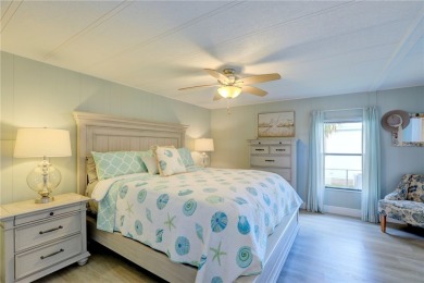 Coastal style home features metal roof & newer A/C and Golf on Barefoot Bay Golf Course in Florida - for sale on GolfHomes.com, golf home, golf lot