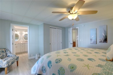 Coastal style home features metal roof & newer A/C and Golf on Barefoot Bay Golf Course in Florida - for sale on GolfHomes.com, golf home, golf lot