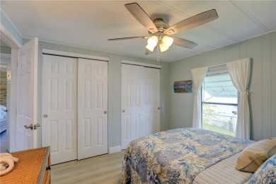 Coastal style home features metal roof & newer A/C and Golf on Barefoot Bay Golf Course in Florida - for sale on GolfHomes.com, golf home, golf lot