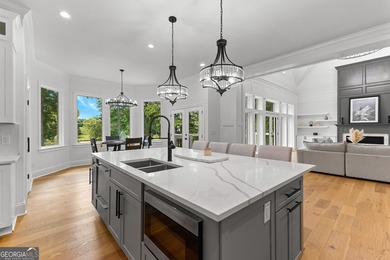 Welcome to this breathtaking four-sided brick estate, perfectly on Whitewater Creek in Georgia - for sale on GolfHomes.com, golf home, golf lot