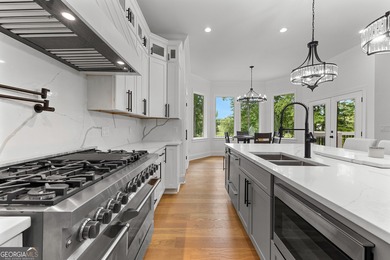 Welcome to this breathtaking four-sided brick estate, perfectly on Whitewater Creek in Georgia - for sale on GolfHomes.com, golf home, golf lot