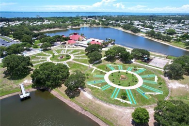 Coastal style home features metal roof & newer A/C and Golf on Barefoot Bay Golf Course in Florida - for sale on GolfHomes.com, golf home, golf lot