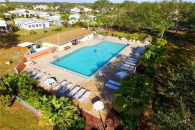 Coastal style home features metal roof & newer A/C and Golf on Barefoot Bay Golf Course in Florida - for sale on GolfHomes.com, golf home, golf lot