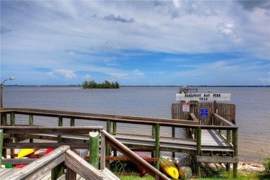 Coastal style home features metal roof & newer A/C and Golf on Barefoot Bay Golf Course in Florida - for sale on GolfHomes.com, golf home, golf lot