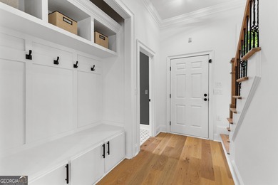 Welcome to this breathtaking four-sided brick estate, perfectly on Whitewater Creek in Georgia - for sale on GolfHomes.com, golf home, golf lot