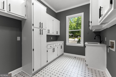 Welcome to this breathtaking four-sided brick estate, perfectly on Whitewater Creek in Georgia - for sale on GolfHomes.com, golf home, golf lot