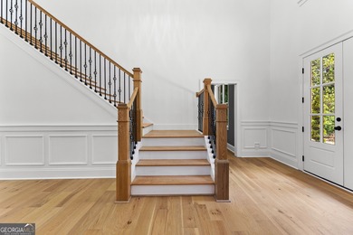 Welcome to this breathtaking four-sided brick estate, perfectly on Whitewater Creek in Georgia - for sale on GolfHomes.com, golf home, golf lot