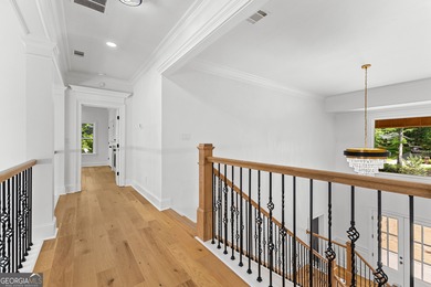 Welcome to this breathtaking four-sided brick estate, perfectly on Whitewater Creek in Georgia - for sale on GolfHomes.com, golf home, golf lot