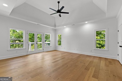 Welcome to this breathtaking four-sided brick estate, perfectly on Whitewater Creek in Georgia - for sale on GolfHomes.com, golf home, golf lot