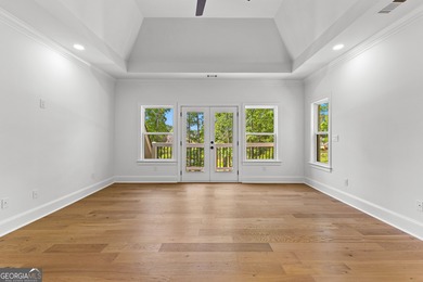 Welcome to this breathtaking four-sided brick estate, perfectly on Whitewater Creek in Georgia - for sale on GolfHomes.com, golf home, golf lot