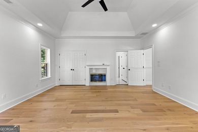 Welcome to this breathtaking four-sided brick estate, perfectly on Whitewater Creek in Georgia - for sale on GolfHomes.com, golf home, golf lot