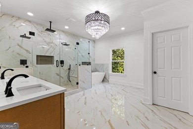 Welcome to this breathtaking four-sided brick estate, perfectly on Whitewater Creek in Georgia - for sale on GolfHomes.com, golf home, golf lot