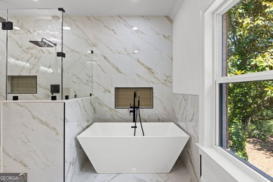 Welcome to this breathtaking four-sided brick estate, perfectly on Whitewater Creek in Georgia - for sale on GolfHomes.com, golf home, golf lot