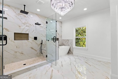 Welcome to this breathtaking four-sided brick estate, perfectly on Whitewater Creek in Georgia - for sale on GolfHomes.com, golf home, golf lot