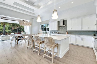 This stunning single-story residence, built in 2023, showcases on The Golf Club At Fiddlers Creek in Florida - for sale on GolfHomes.com, golf home, golf lot