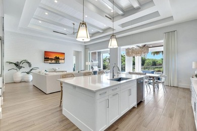This stunning single-story residence, built in 2023, showcases on The Golf Club At Fiddlers Creek in Florida - for sale on GolfHomes.com, golf home, golf lot
