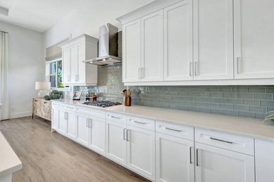 This stunning single-story residence, built in 2023, showcases on The Golf Club At Fiddlers Creek in Florida - for sale on GolfHomes.com, golf home, golf lot