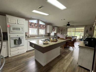 This three-bed, two-bath beauty is spacious and clean with on Four Lakes Golf Club in Florida - for sale on GolfHomes.com, golf home, golf lot