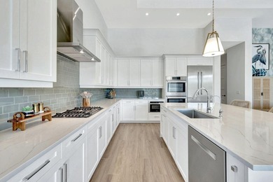 This stunning single-story residence, built in 2023, showcases on The Golf Club At Fiddlers Creek in Florida - for sale on GolfHomes.com, golf home, golf lot