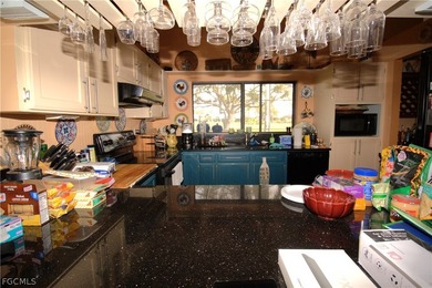 High Ceiling Greatroom with a POOL directly on PALMETTO PINES on Palmetto-Pine Country Club in Florida - for sale on GolfHomes.com, golf home, golf lot